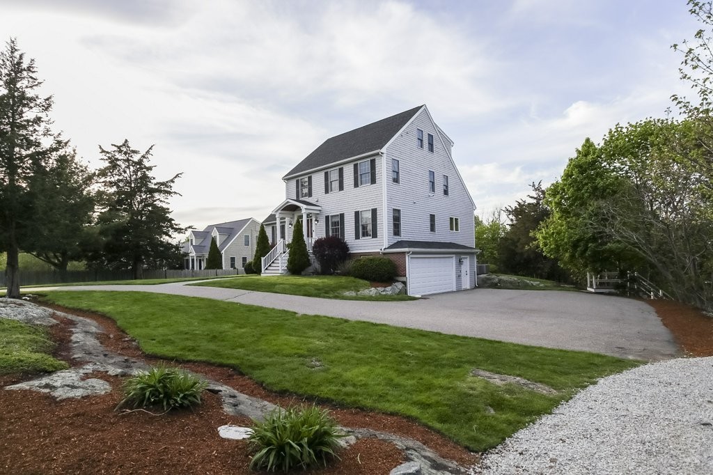 18 Spring Valley Road Hull, MA 02045 - Photo 29 of 30 a front view of a house with a yard