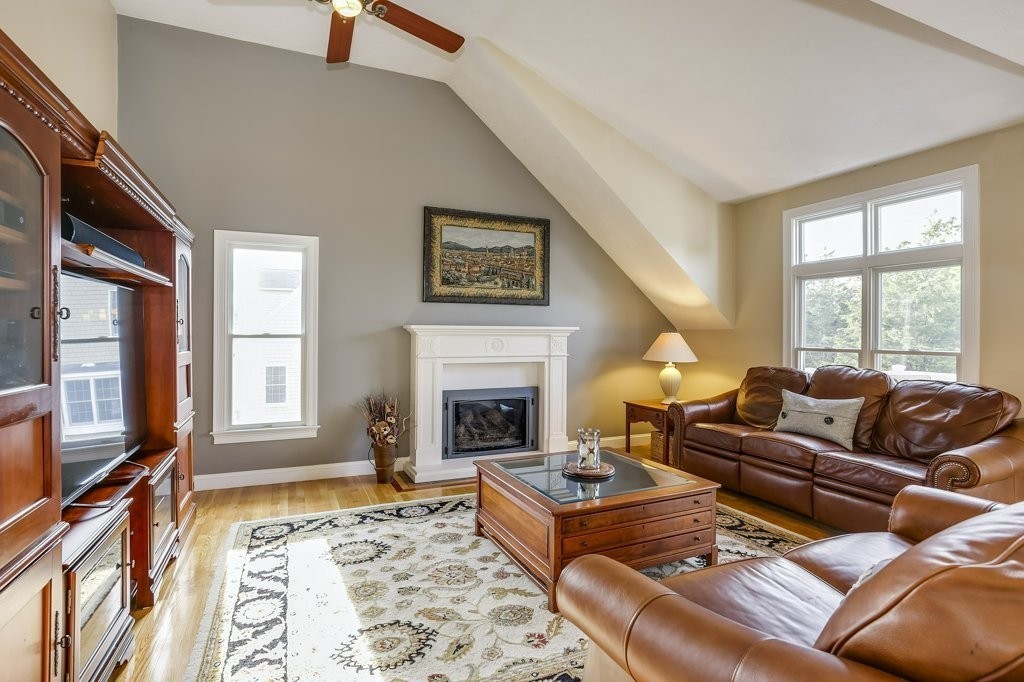 18 Spring Valley Road Hull, MA 02045 - Photo 8 of 30 a living room with furniture large window and a fireplace