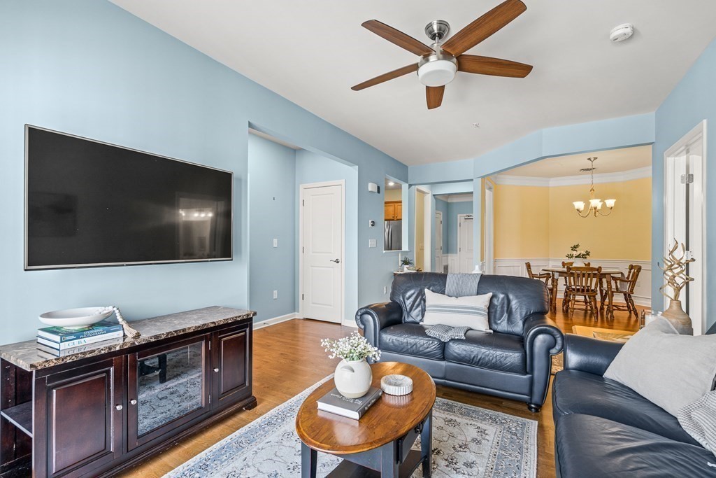 36 Abigail Way, Unit 3009 Reading, MA 01867 - Photo 11 of 36 a living room with furniture and a flat screen tv