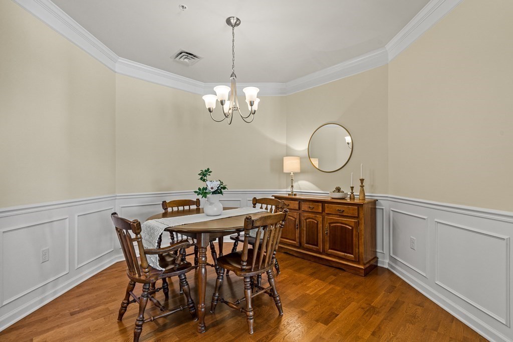 36 Abigail Way, Unit 3009 Reading, MA 01867 - Photo 14 of 36 a view of a dining room with furniture and chandelier
