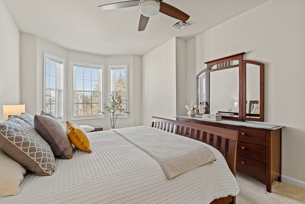 36 Abigail Way, Unit 3009 Reading, MA 01867 - Photo 18 of 36 a bedroom with a large bed and a large window