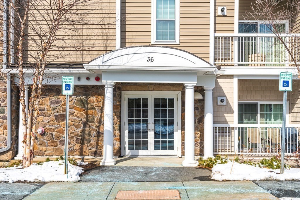36 Abigail Way, Unit 3009 Reading, MA 01867 - Photo 2 of 36 front view of a brick house
