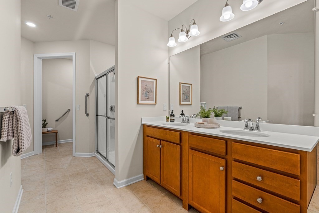 36 Abigail Way, Unit 3009 Reading, MA 01867 - Photo 21 of 36 a spacious bathroom with a granite countertop sink mirror and double