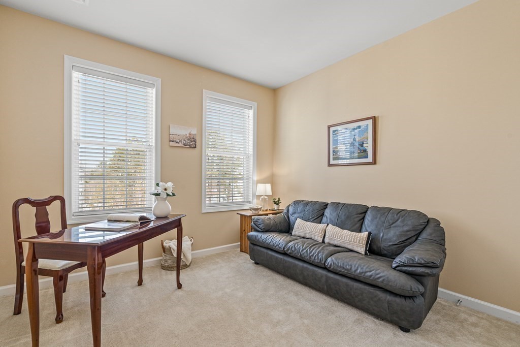 36 Abigail Way, Unit 3009 Reading, MA 01867 - Photo 25 of 36 a living room with furniture and a window