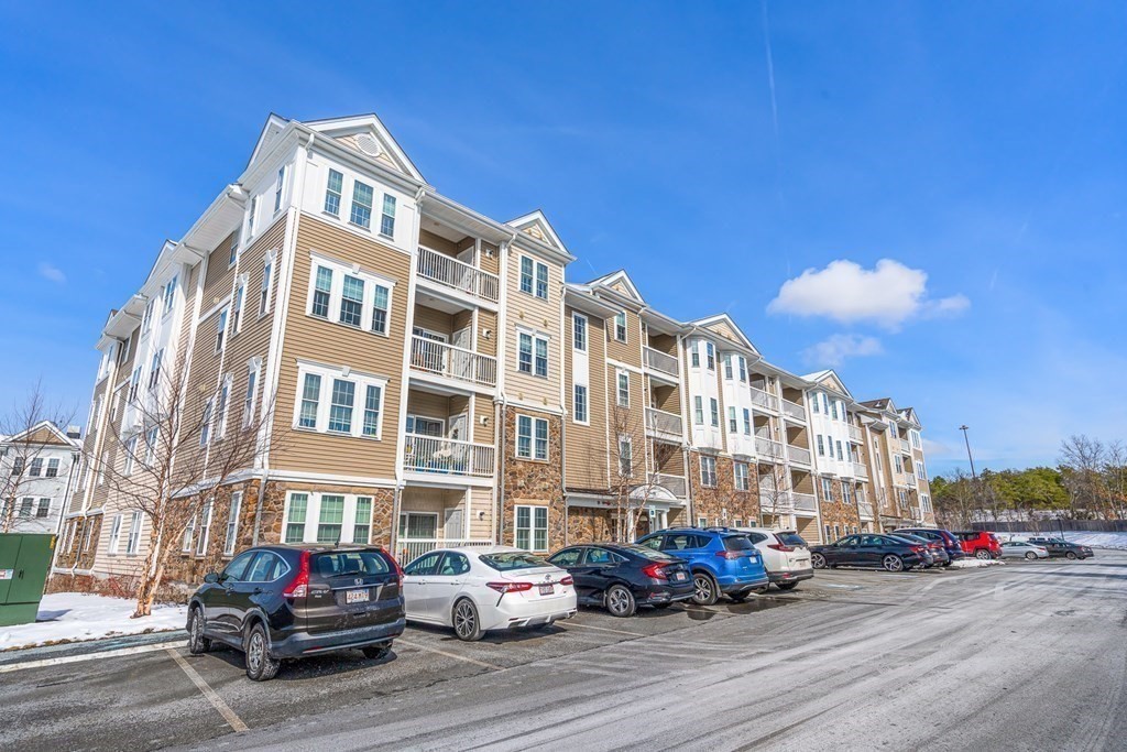 36 Abigail Way, Unit 3009 Reading, MA 01867 - Photo 32 of 36 a buildings with car parked in front of it