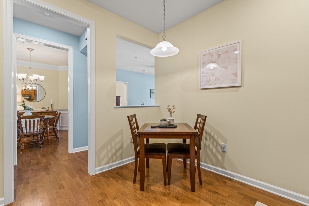36 Abigail Way, Unit 3009 Reading, MA 01867 - Photo 8 of 36 a view of a dining room with furniture and a chandelier fan
