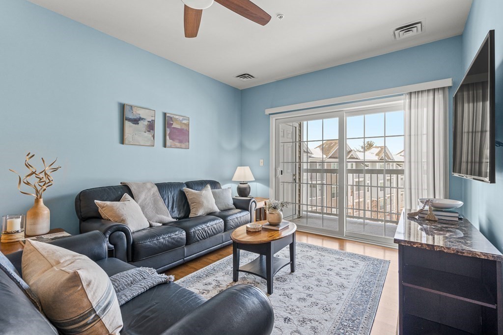 36 Abigail Way, Unit 3009 Reading, MA 01867 - Photo 9 of 36 a living room with furniture and a window