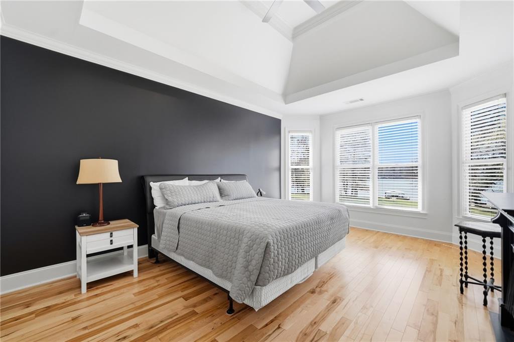 1810 Kilough Church Road Dawsonville, GA 30534 - Photo 11 of 29 a bedroom with a bed and a large window