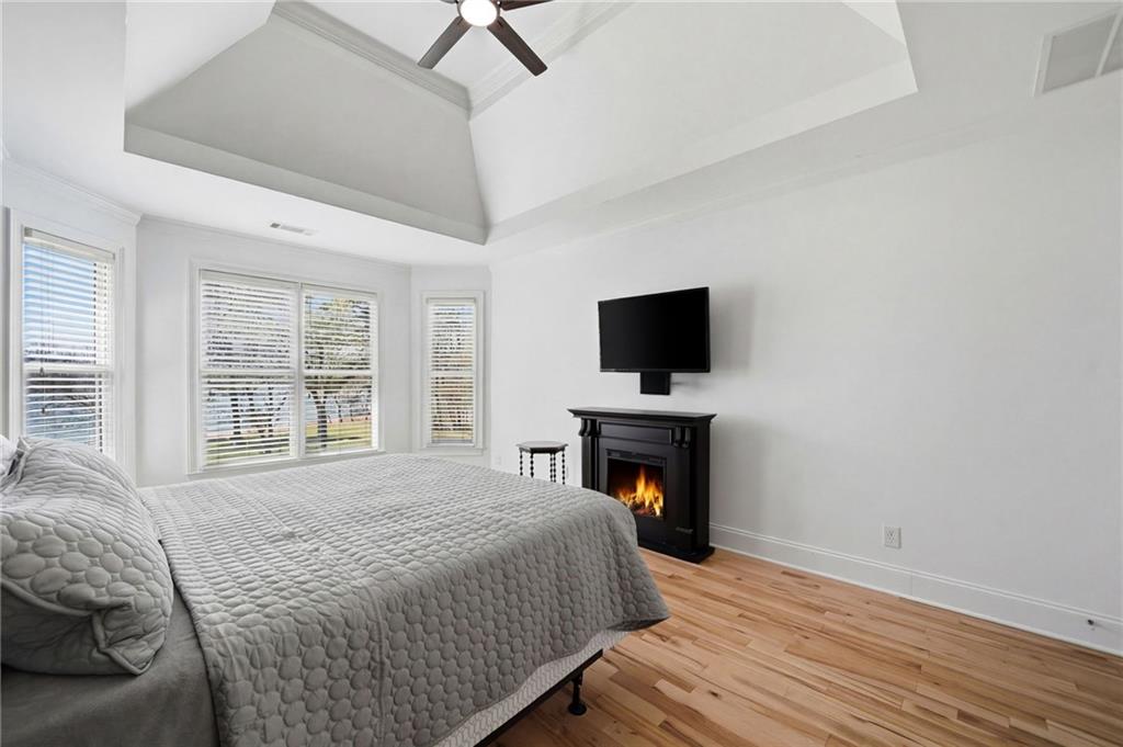 1810 Kilough Church Road Dawsonville, GA 30534 - Photo 12 of 29 a bedroom with a bed and a flat screen tv