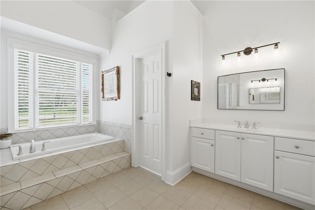 1810 Kilough Church Road Dawsonville, GA 30534 - Photo 13 of 29 a spacious bathroom with a tub sink and mirror
