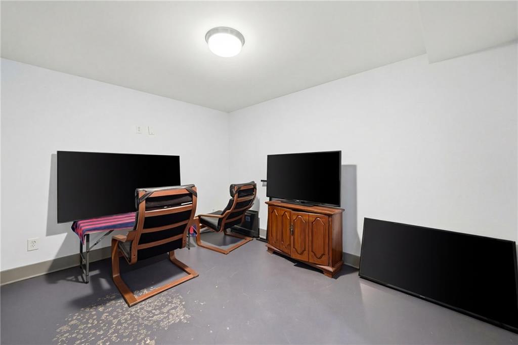 1810 Kilough Church Road Dawsonville, GA 30534 - Photo 19 of 29 a room with furniture and a flat screen tv