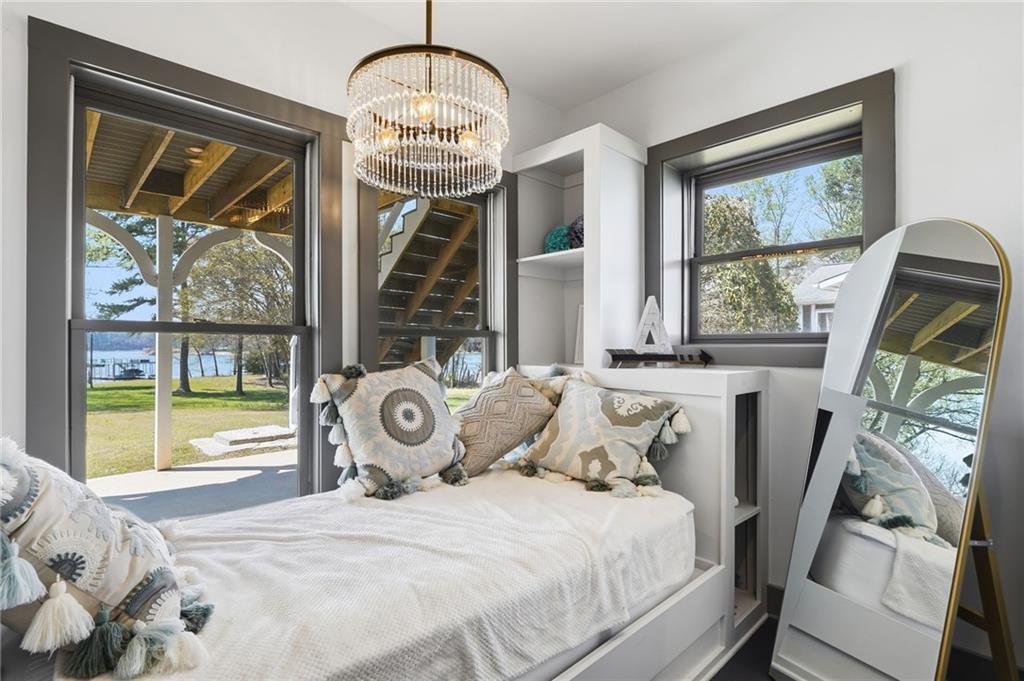 1810 Kilough Church Road Dawsonville, GA 30534 - Photo 23 of 29 a bedroom with a bed and a window