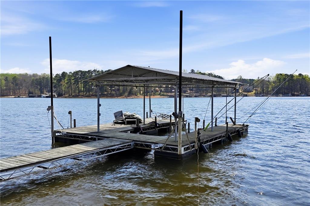 1810 Kilough Church Road Dawsonville, GA 30534 - Photo 4 of 29 a view of a lake with chairs