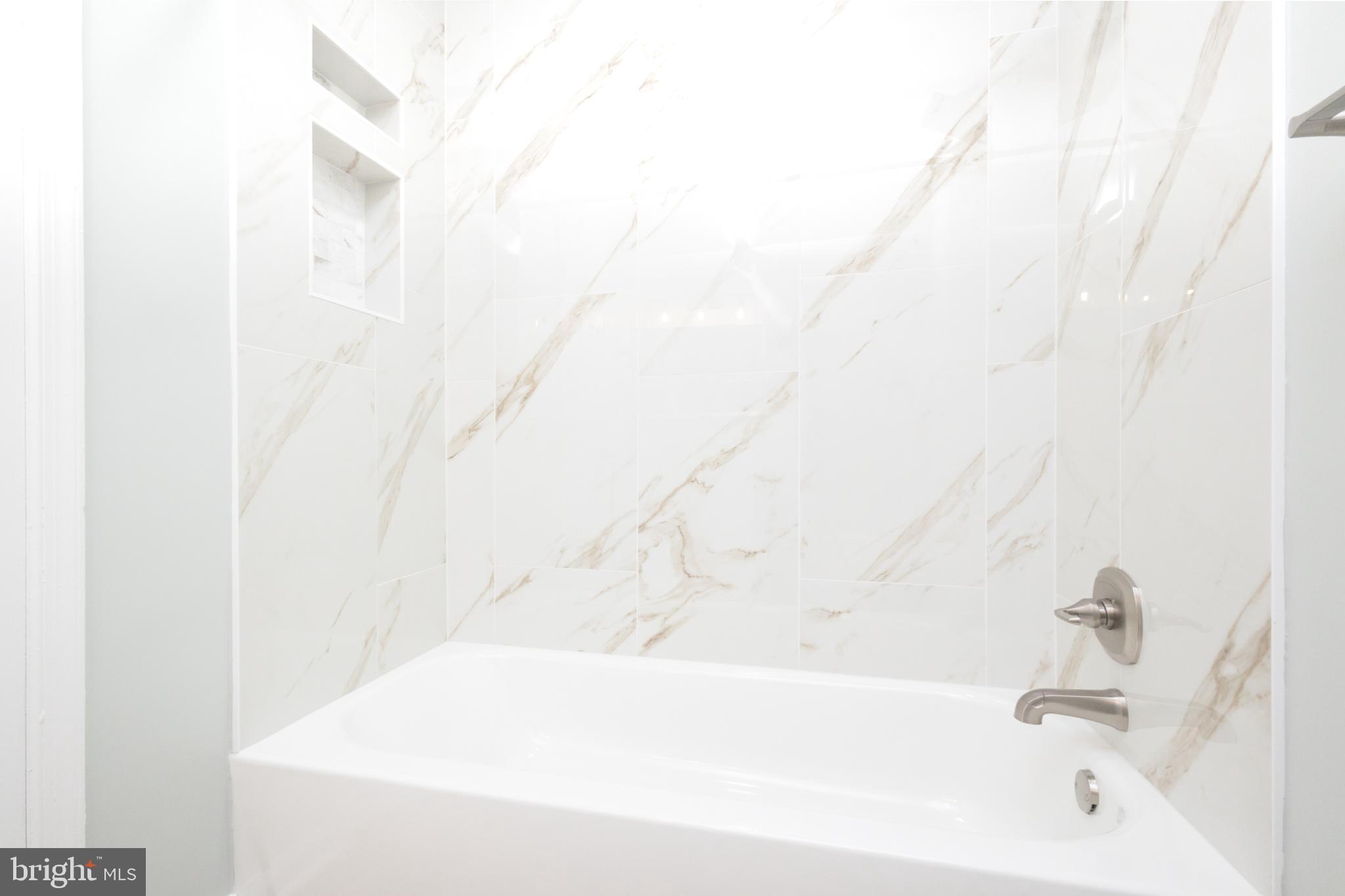 8058 Felecity Court Springfield, VA 22153 - Photo 22 of 35 a bathroom with a bathtub