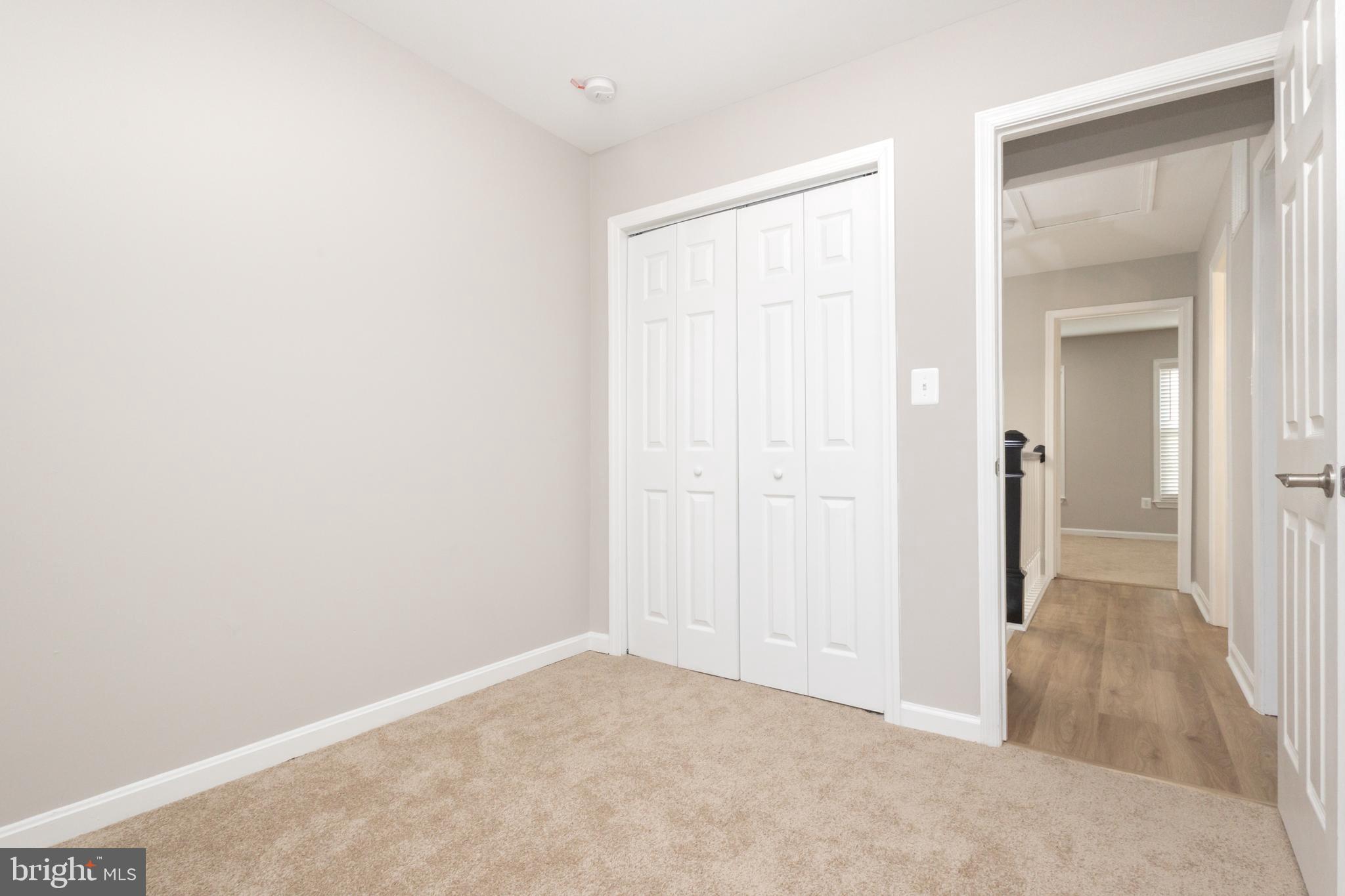 8058 Felecity Court Springfield, VA 22153 - Photo 30 of 35 an empty room with closet and a bathroom