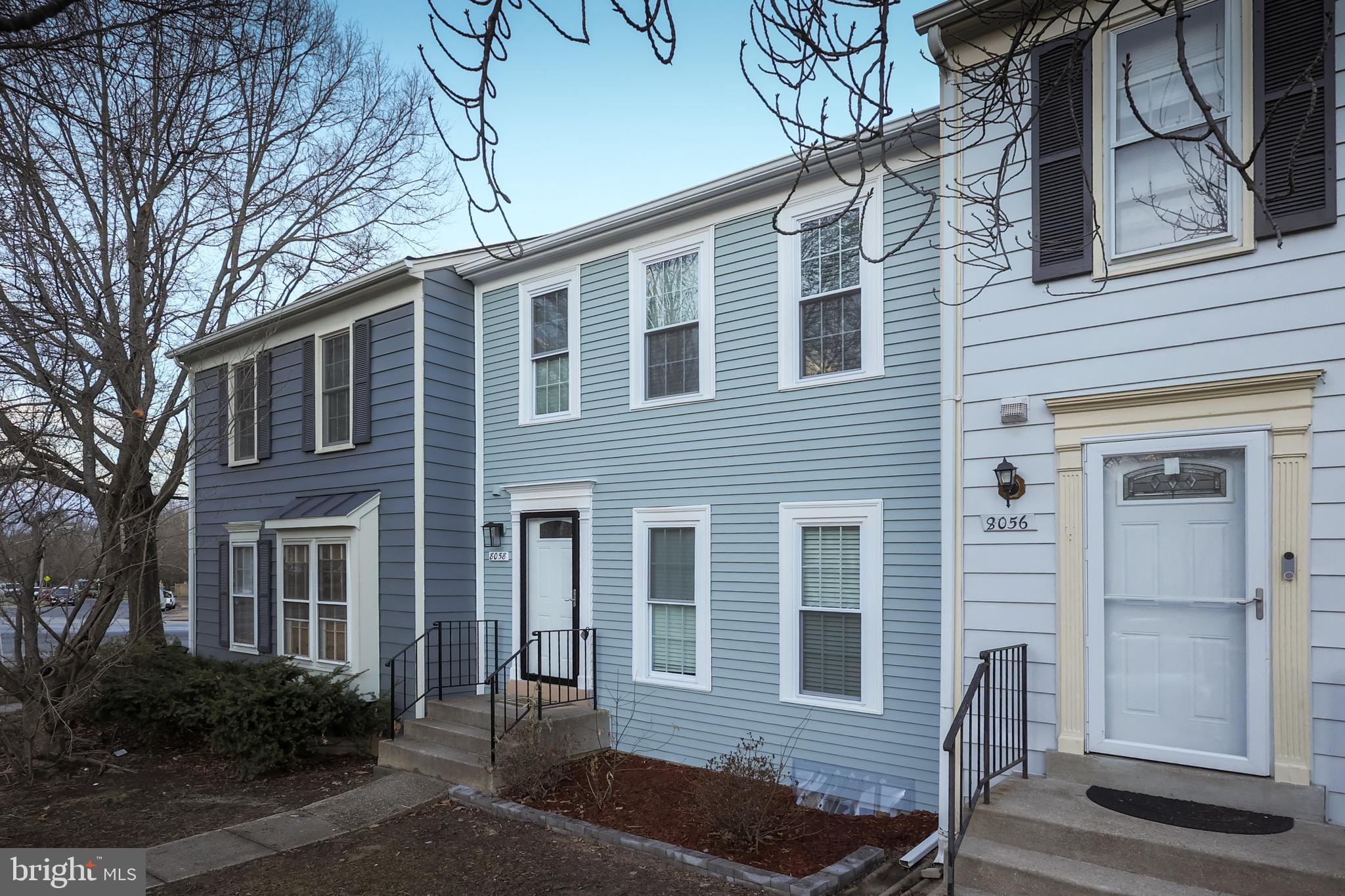 8058 Felecity Court Springfield, VA 22153 - Photo 3 of 35 a front view of a house with garden