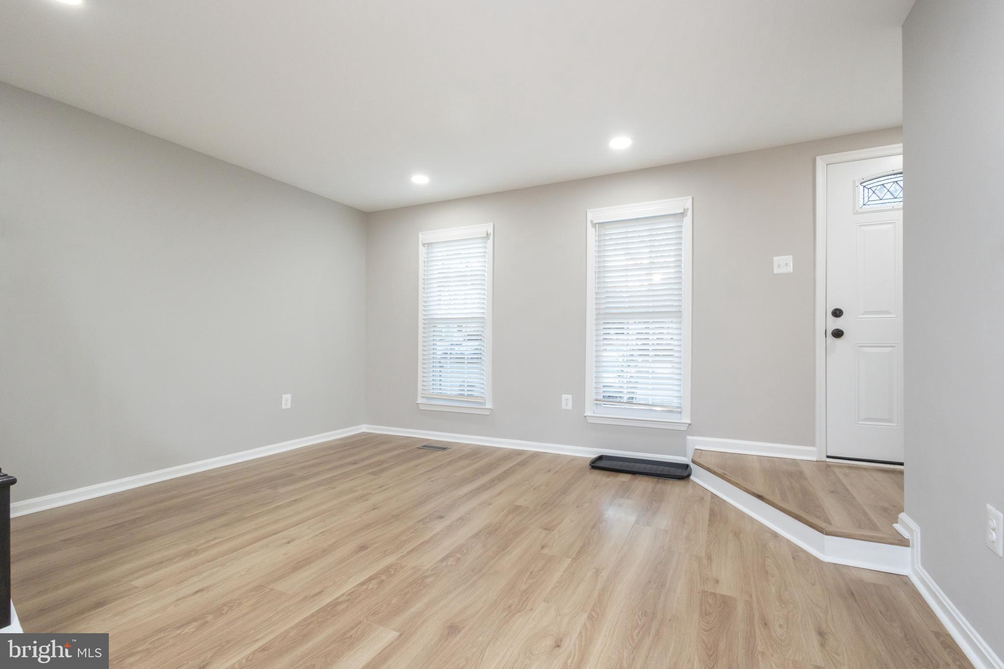 8058 Felecity Court Springfield, VA 22153 - Photo 31 of 35 a view of empty room with wooden floor and fan