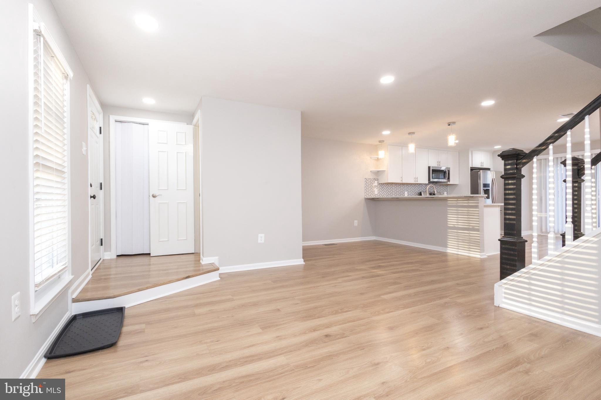 8058 Felecity Court Springfield, VA 22153 - Photo 4 of 35 a view of a kitchen with wooden floor and a kitchen
