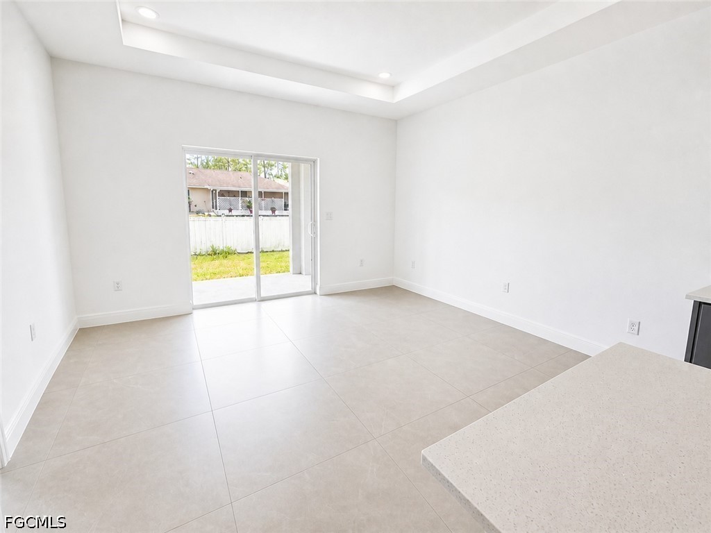 8753 Buckingham Road Lehigh Acres, FL 33971 - Photo 3 of 13 a view of an empty room with a window