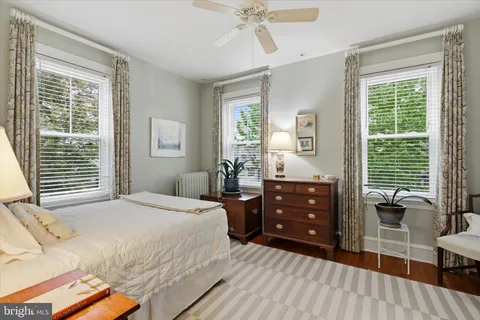 a bedroom with a bed and a furniture