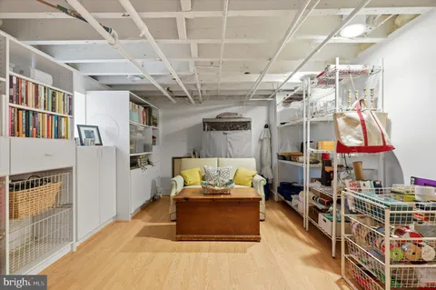 a living room with lots of furniture and a chandelier