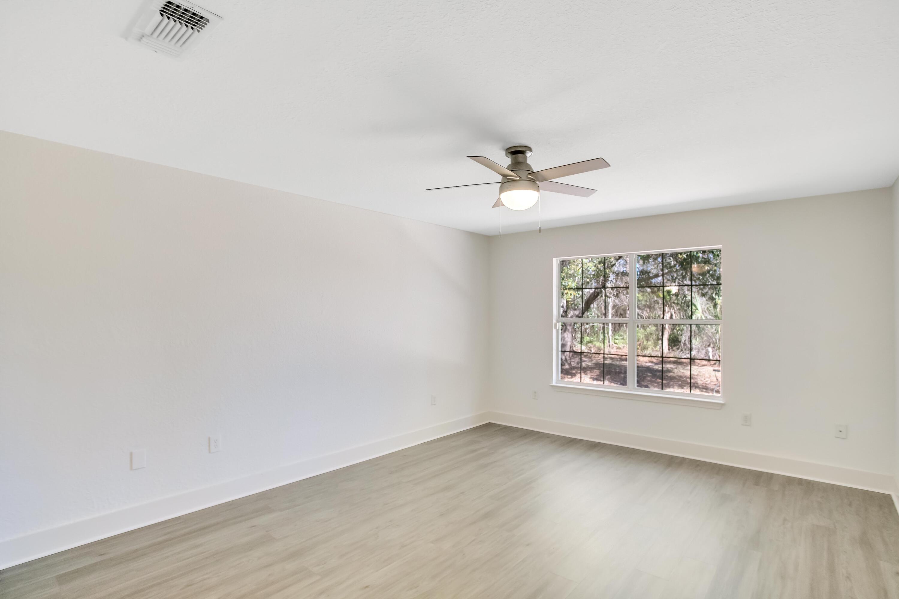 284 Shipwreck Road Santa Rosa Beach, FL 32459 - Photo 17 of 43 an empty room with a window