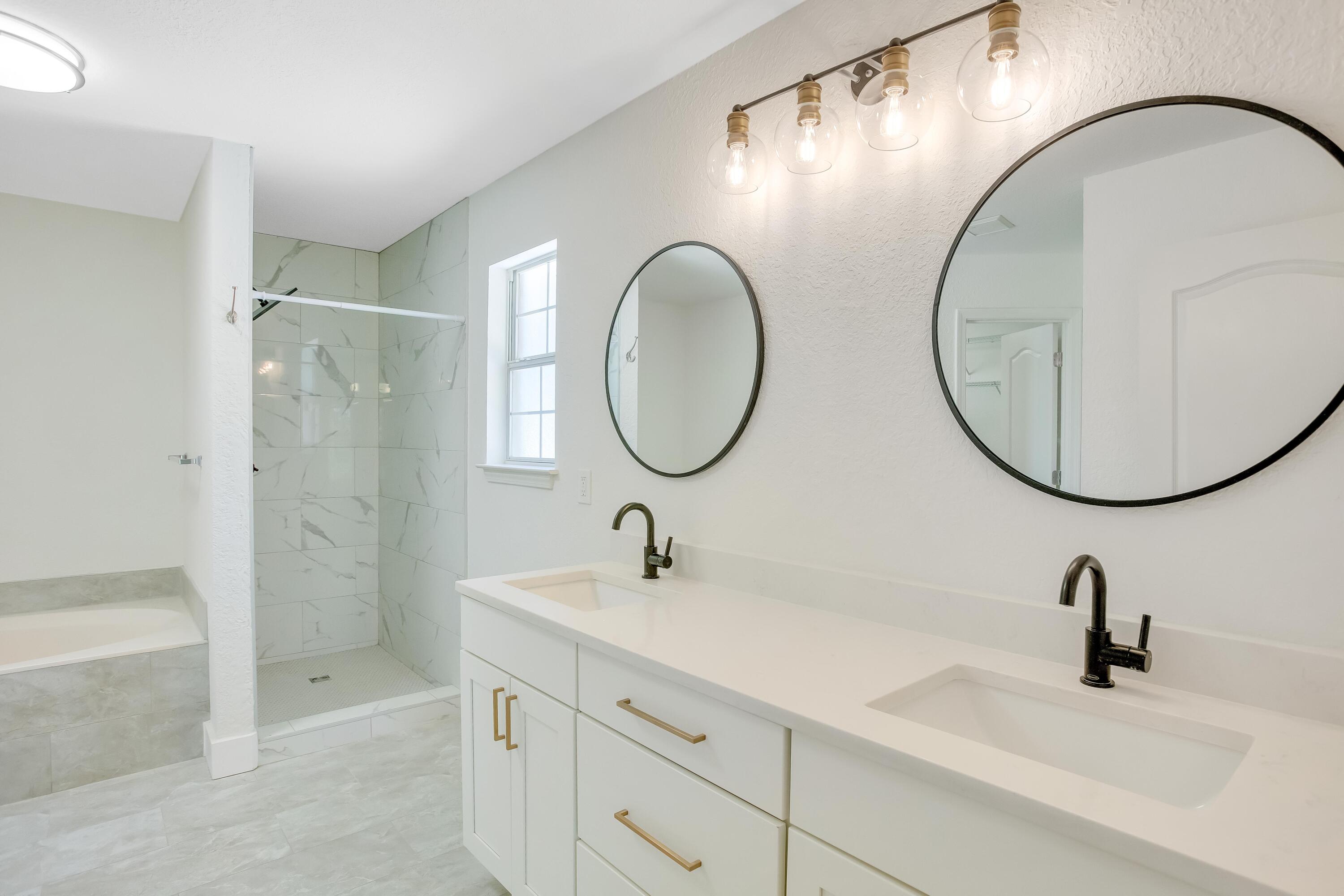 284 Shipwreck Road Santa Rosa Beach, FL 32459 - Photo 20 of 43 a bathroom with a sink and a mirror