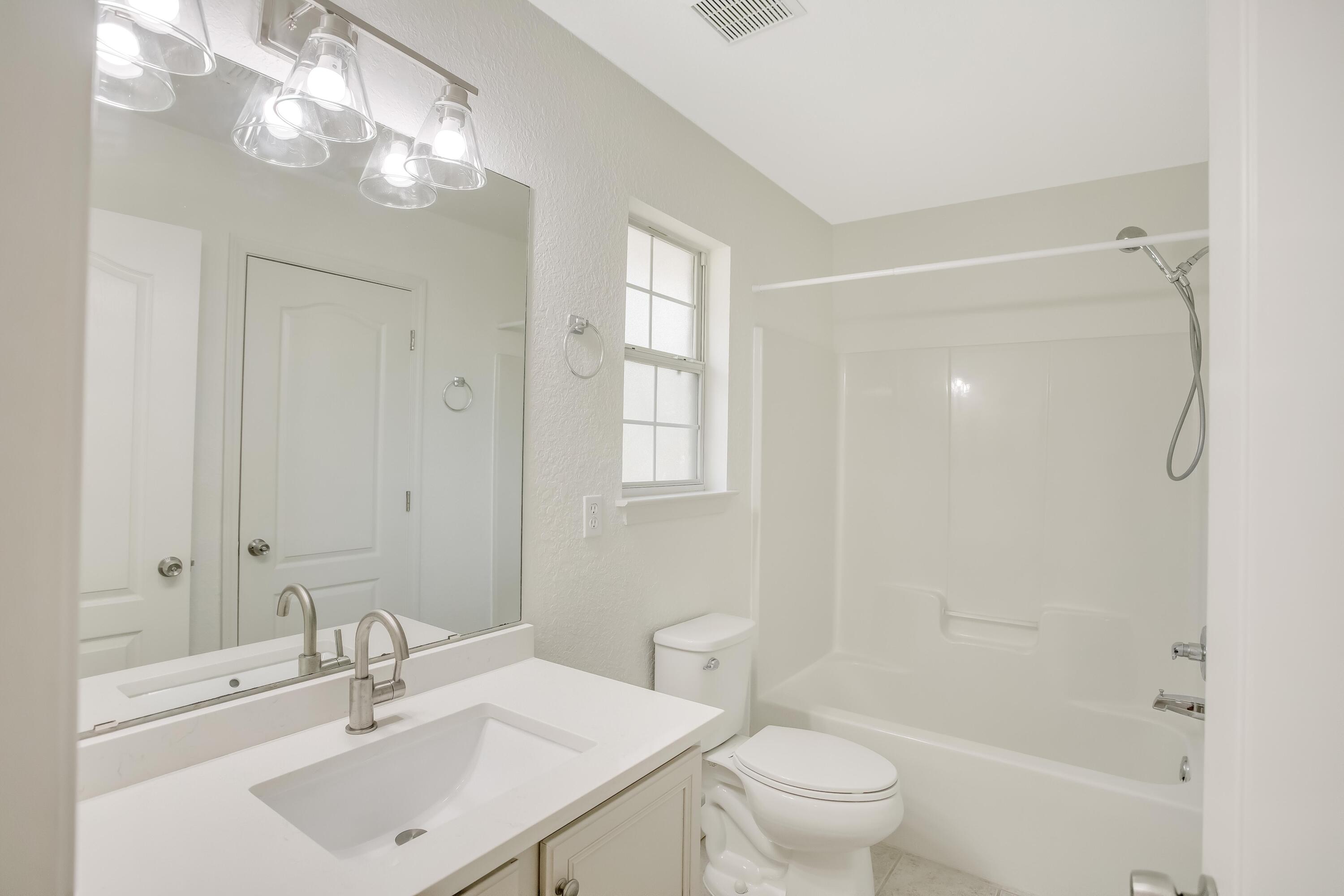 284 Shipwreck Road Santa Rosa Beach, FL 32459 - Photo 27 of 43 a bathroom with a sink a toilet and shower