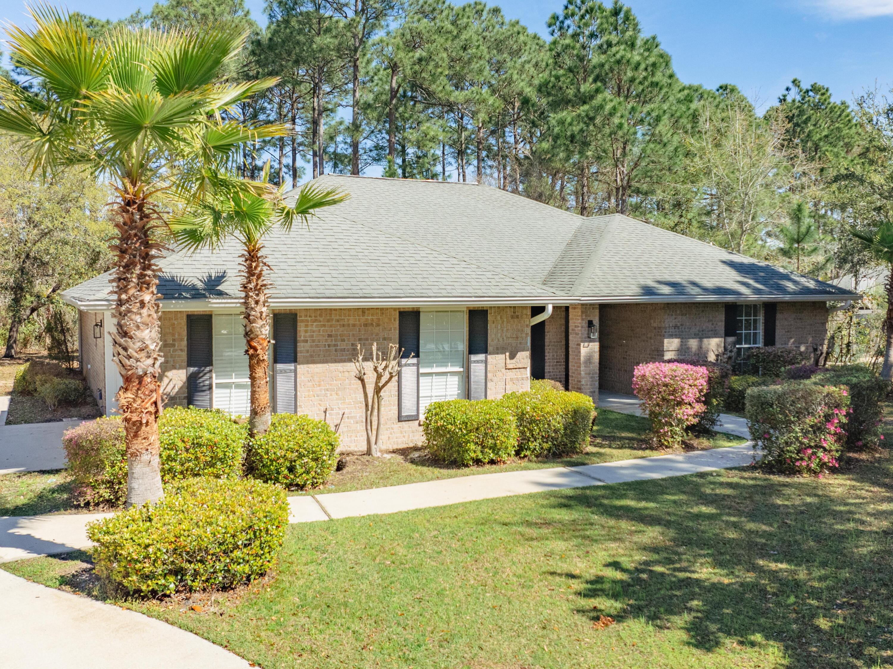 284 Shipwreck Road Santa Rosa Beach, FL 32459 - Photo 3 of 43 a front view of a house with garden