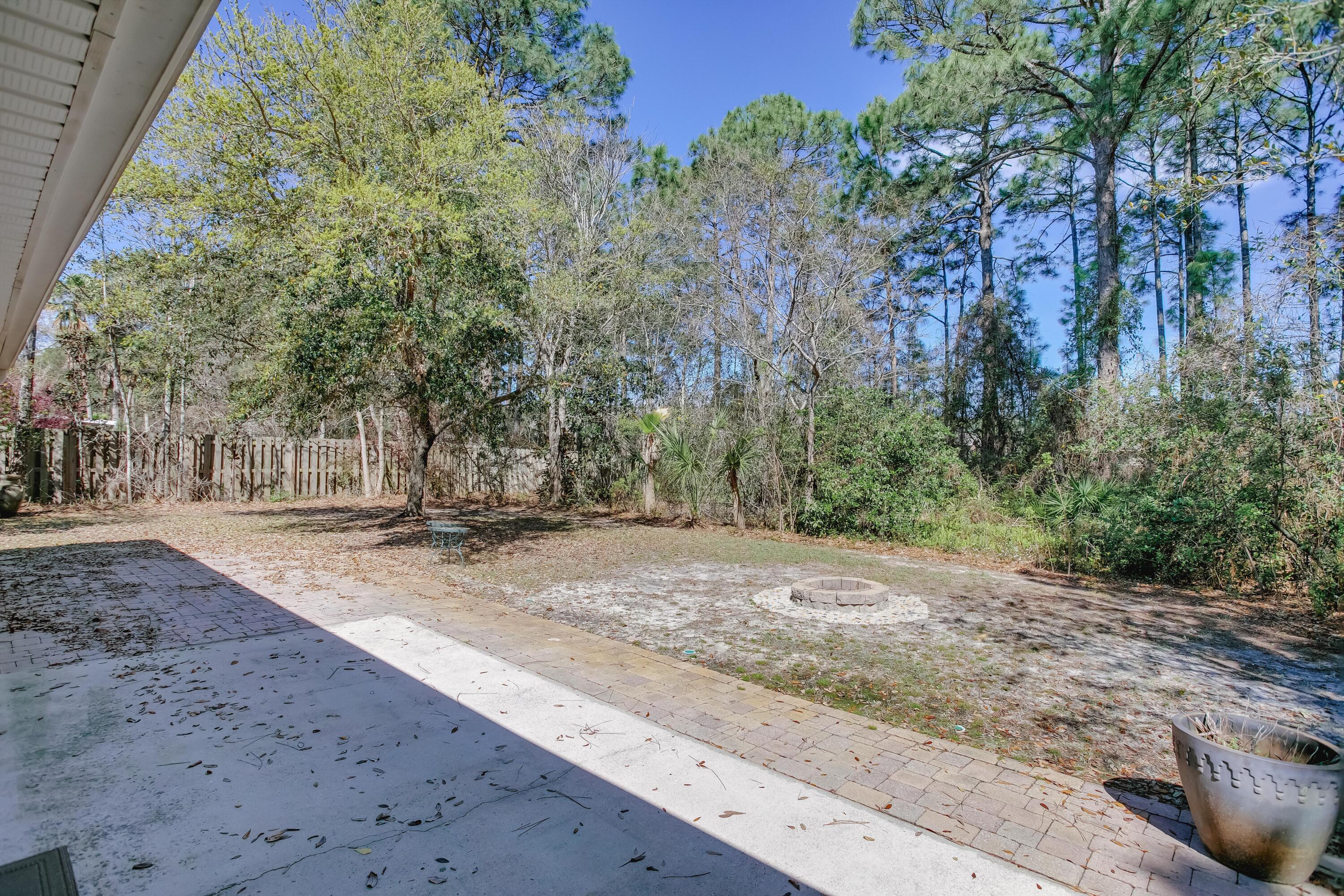 284 Shipwreck Road Santa Rosa Beach, FL 32459 - Photo 32 of 43 a view of a yard with plants and trees