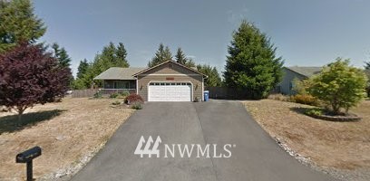 17310 Privet Court Southwest Rochester, WA 98579 - Photo 1 of 1 a front view of a house with a yard and garage