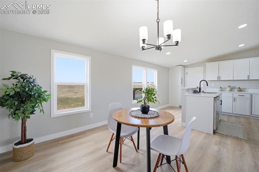 35125 Book Road Yoder, CO 80864 - Photo 19 of 45 a view of a dining room with furniture window and wooden floor