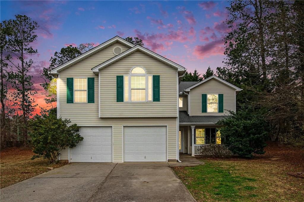 1259 Maxey Court Winder, GA 30680 - Photo 1 of 30 a front view of a house with a yard and garage
