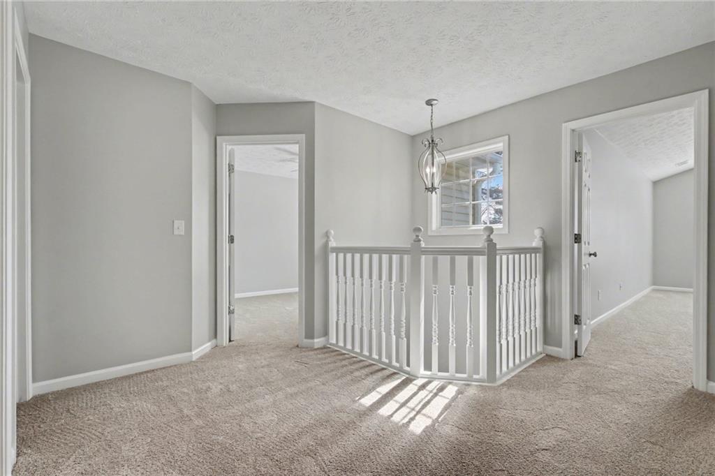 1259 Maxey Court Winder, GA 30680 - Photo 13 of 30 a view of a hallway with a window and stairs