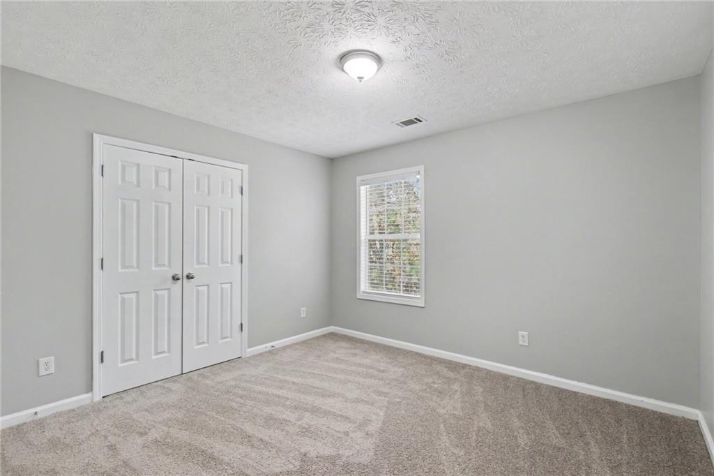 1259 Maxey Court Winder, GA 30680 - Photo 19 of 30 a view of an empty room with a window