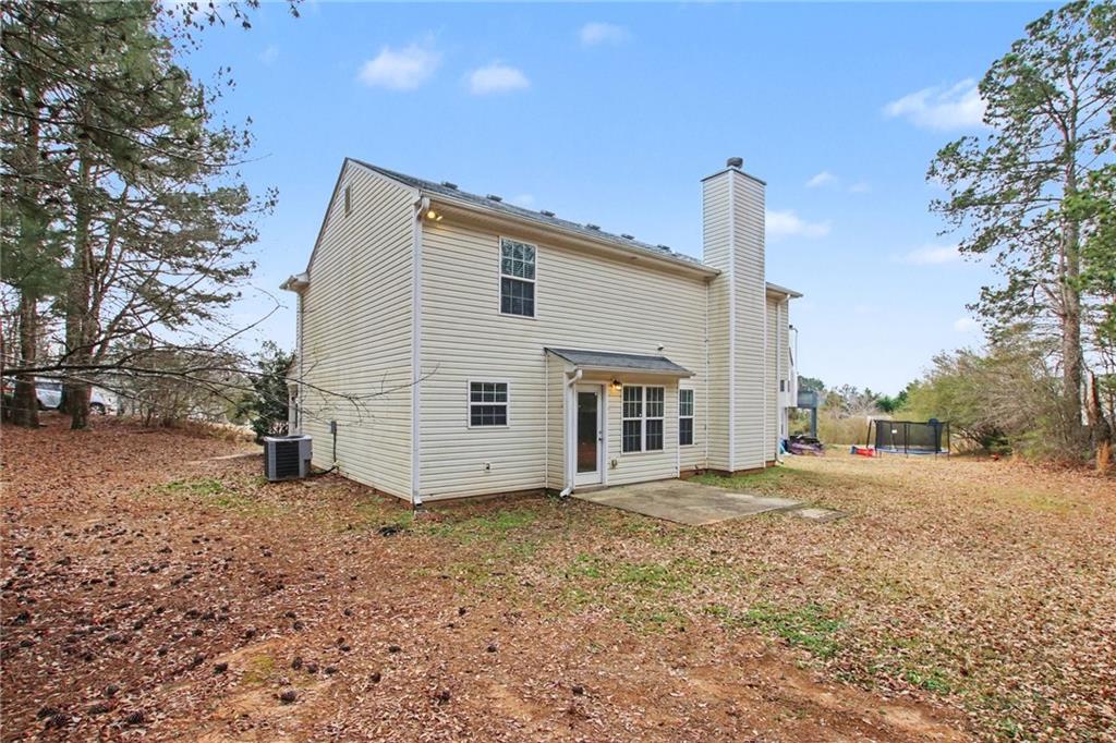 1259 Maxey Court Winder, GA 30680 - Photo 25 of 30 a view of a house with a yard