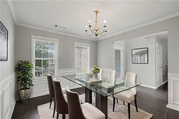 a view of a dining room with furniture window and wooden floor