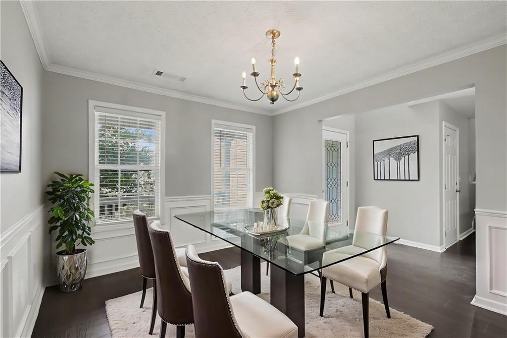 1259 Maxey Court Winder, GA 30680 - Photo 3 of 30 a view of a dining room with furniture window and wooden floor