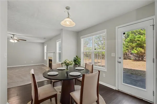 a view of a dining room with furniture window and wooden floor