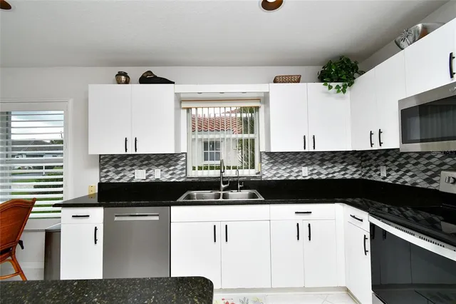 a kitchen with a sink and cabinets