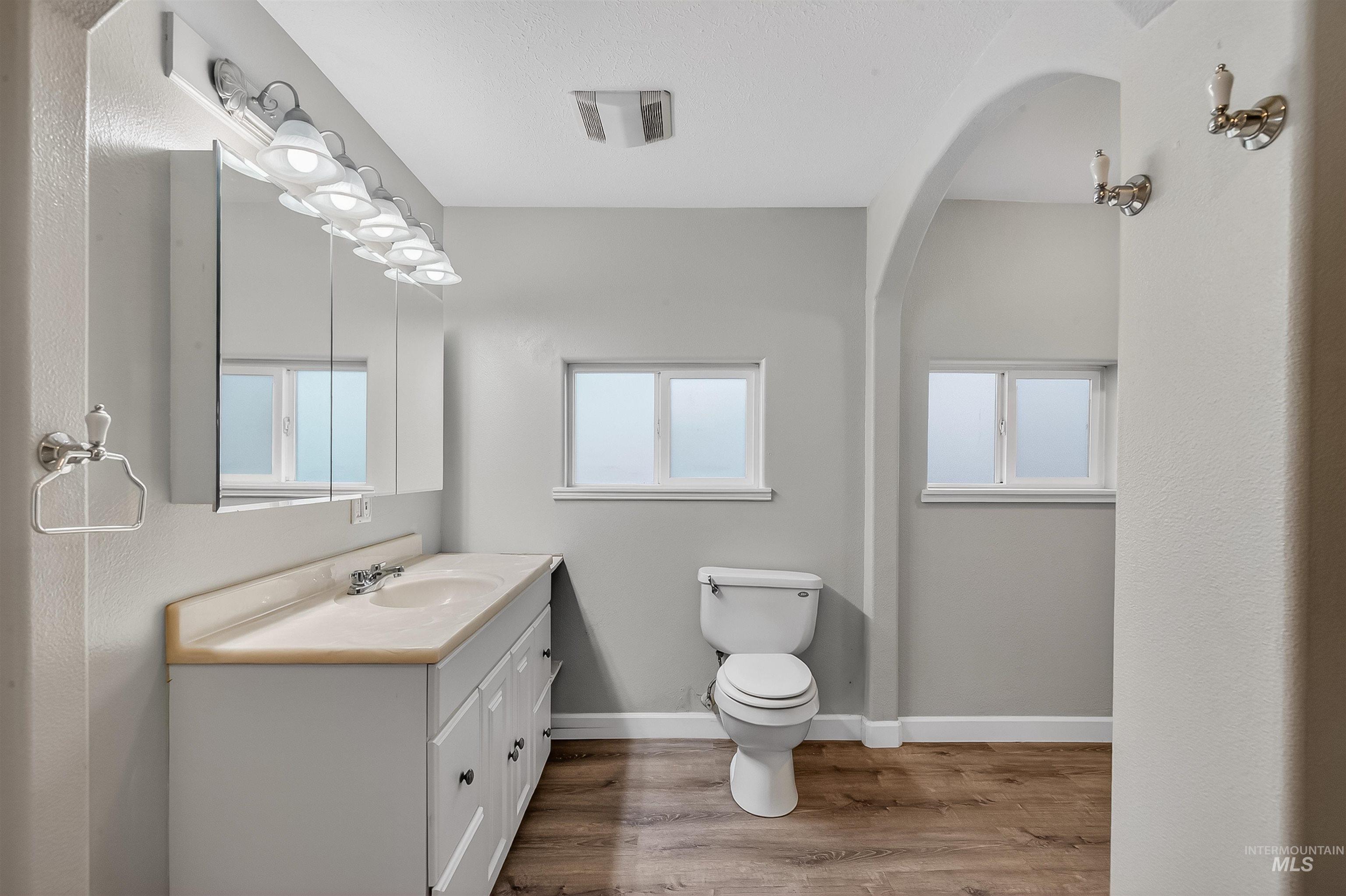 833 8th Street Clarkston, WA 99403 - Photo 17 of 40 Half bathroom featuring vanity and light wood-style flooring