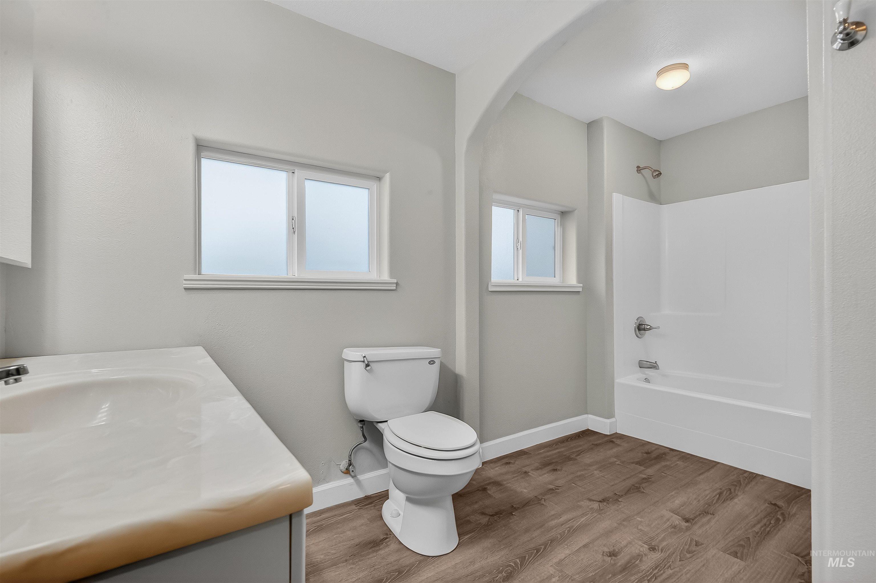 833 8th Street Clarkston, WA 99403 - Photo 18 of 40 Bathroom featuring vanity, shower / tub combination, and light wood-style floors