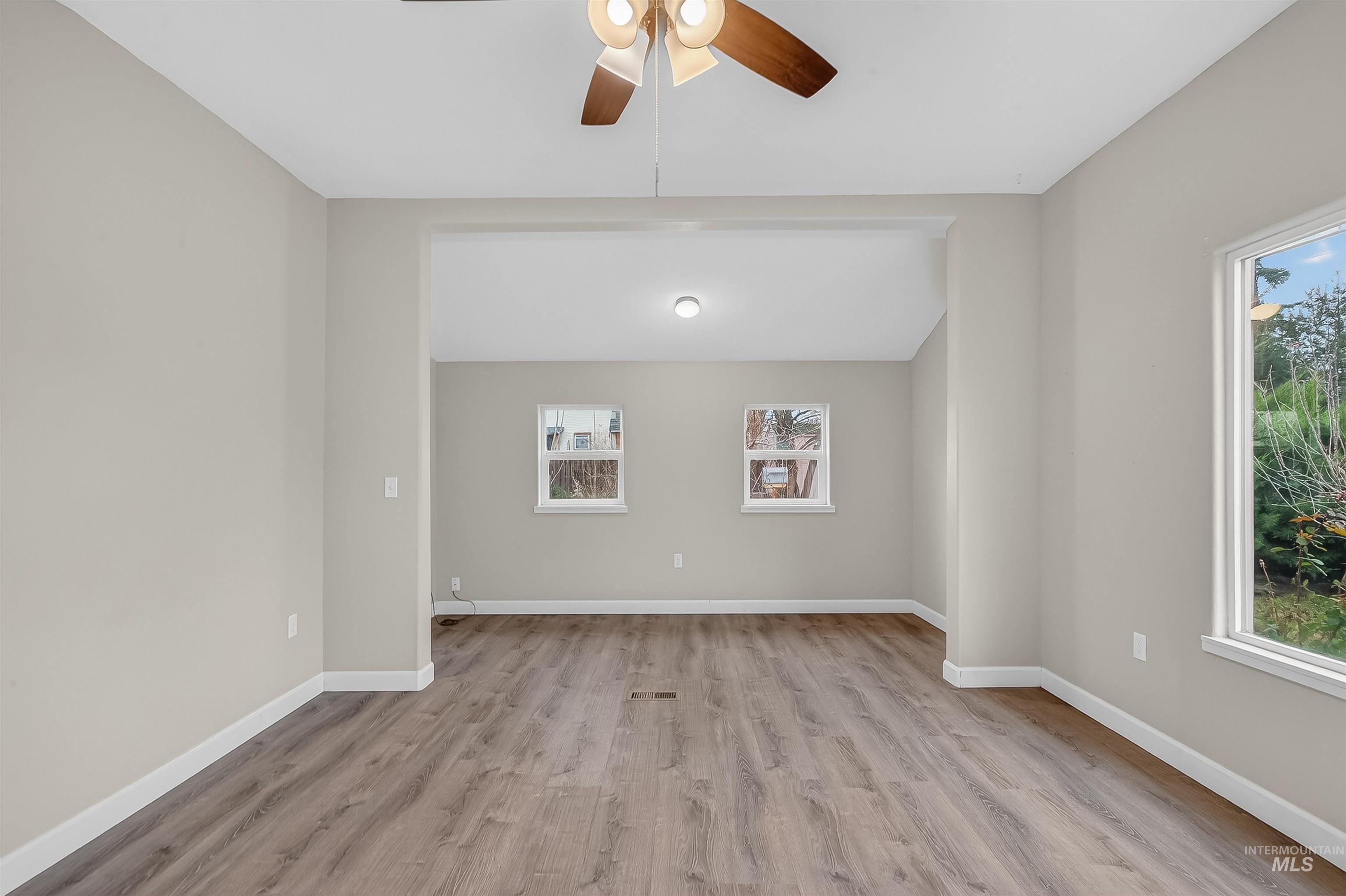 833 8th Street Clarkston, WA 99403 - Photo 3 of 40 Empty room featuring light wood-type flooring and ceiling fan
