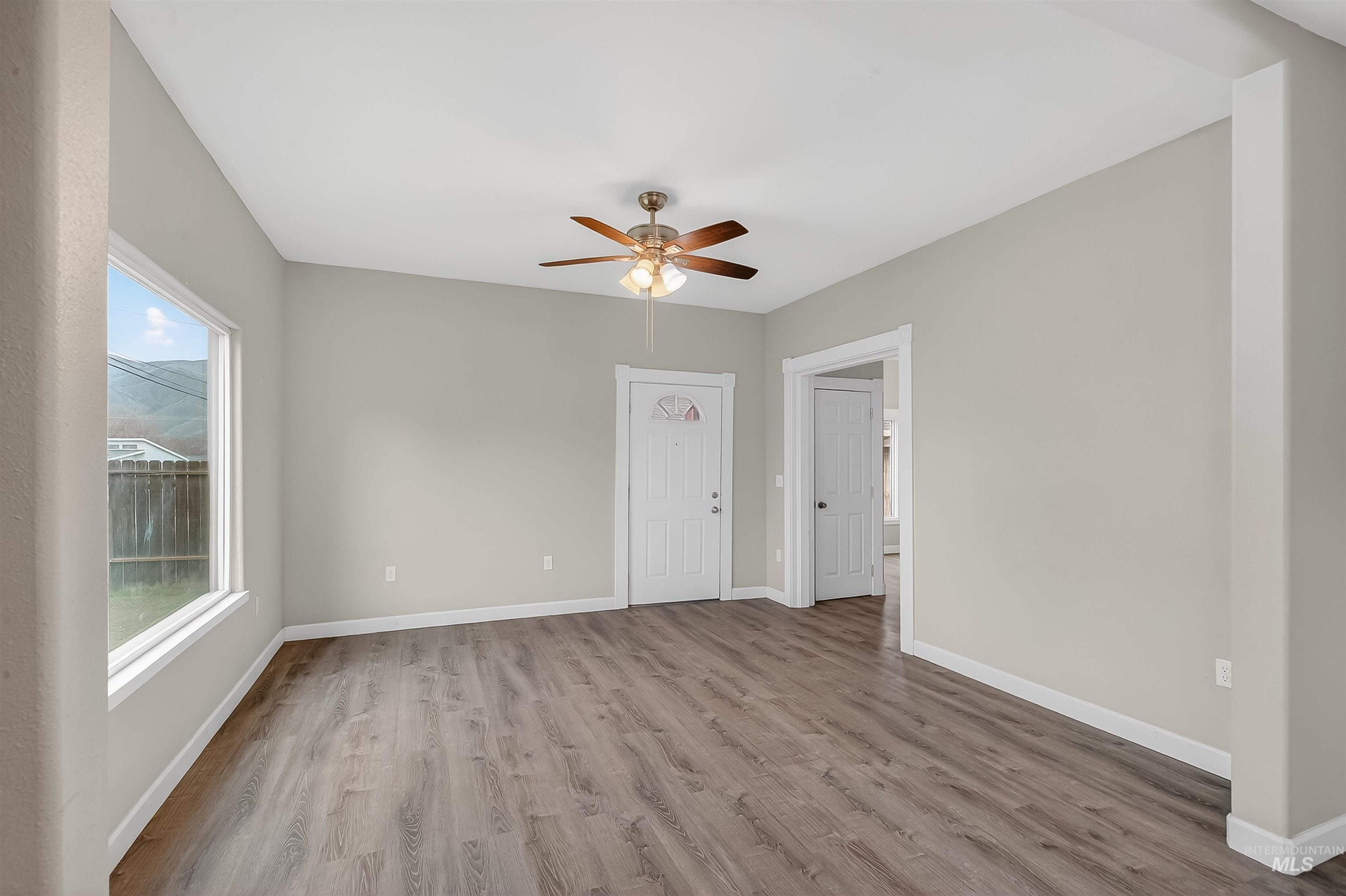 833 8th Street Clarkston, WA 99403 - Photo 4 of 40 Empty room featuring light wood-type flooring and ceiling fan