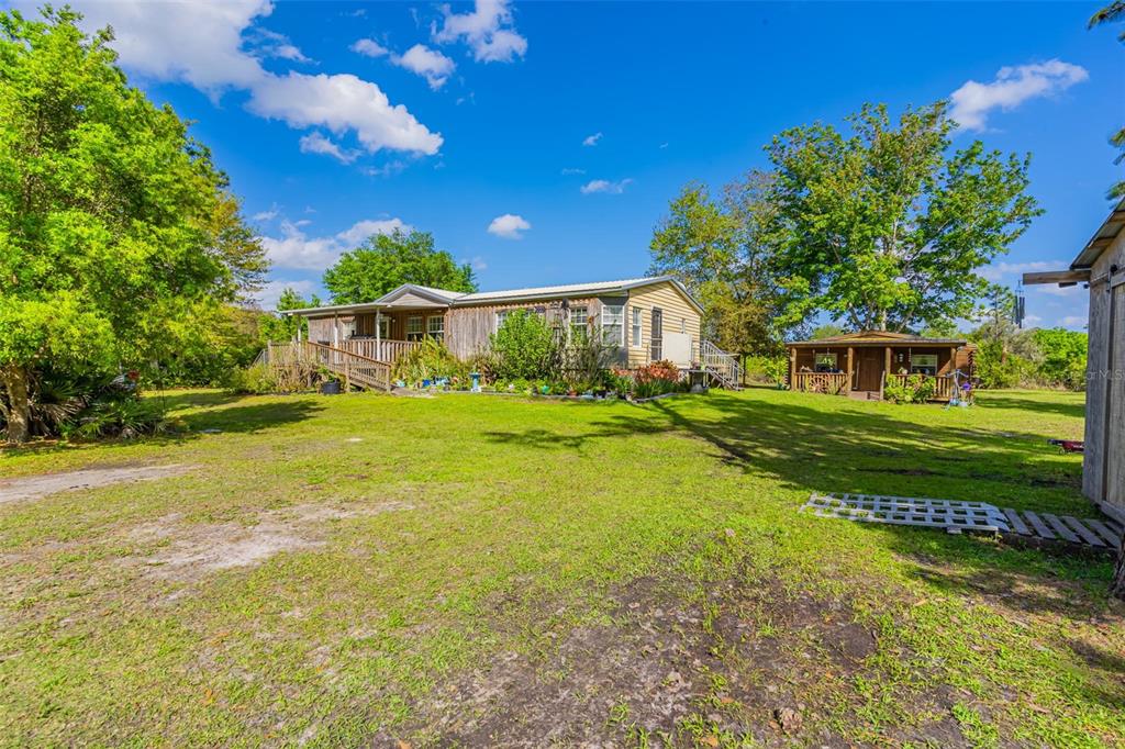 a view of a house with a big yard