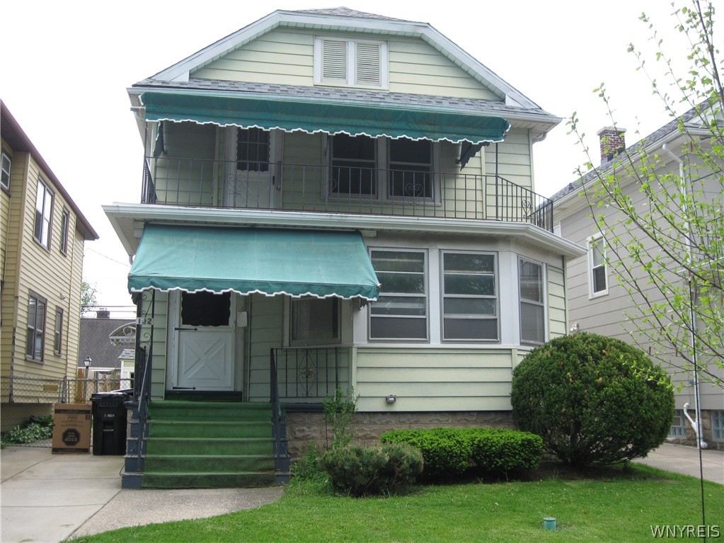 Front of home with Awnings