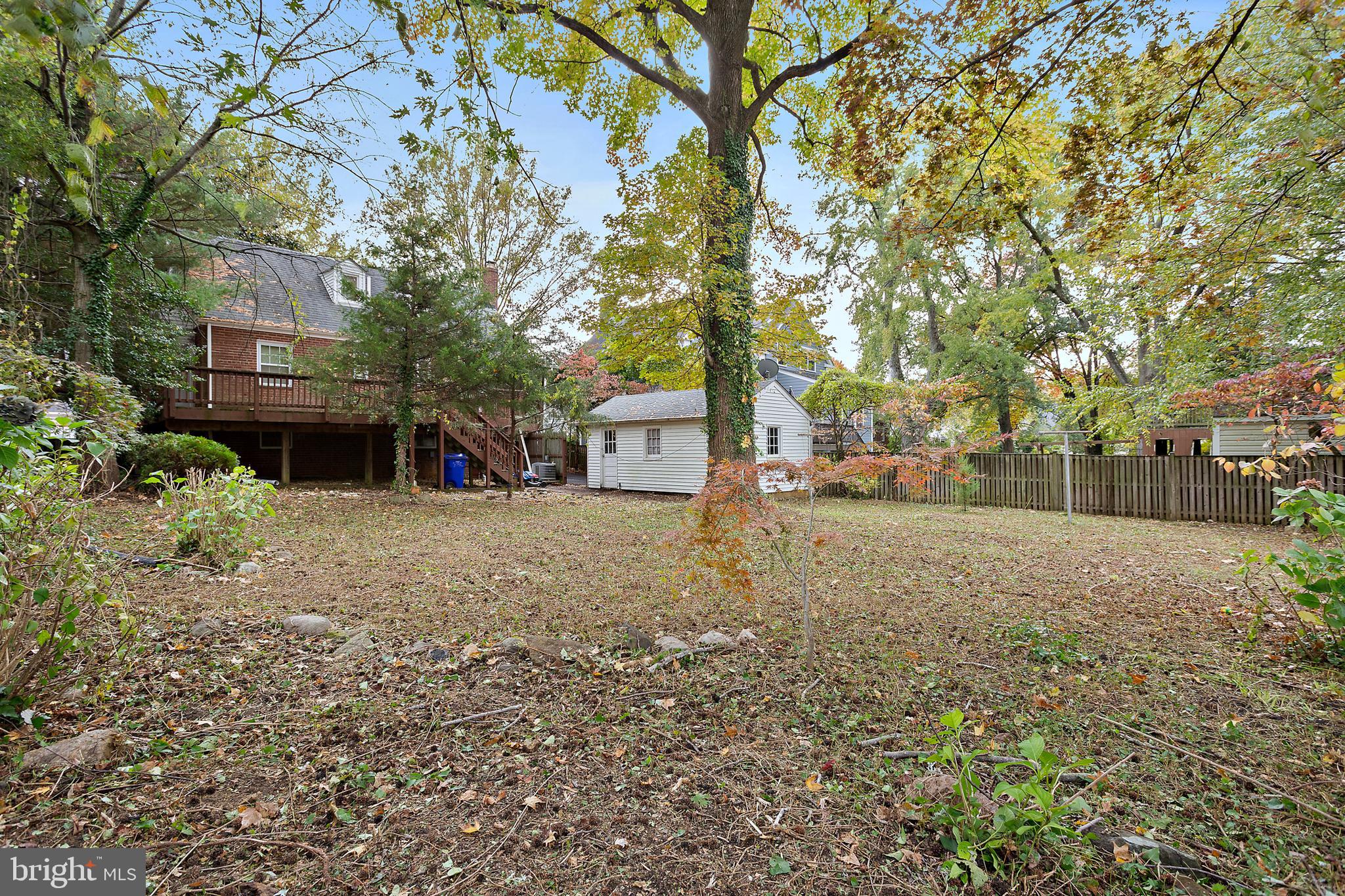 5913 Rolston Road Bethesda, MD 20817 - Photo 34 of 37 a view of a house with a yard and tree s