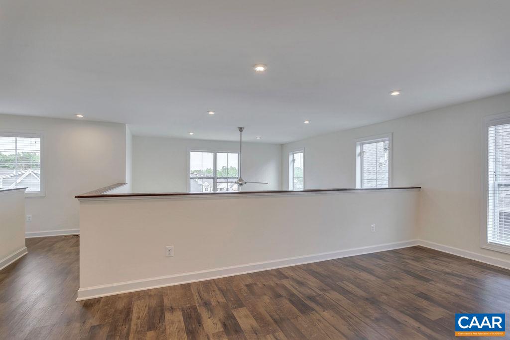 3267 Horizon Road Charlottesville, VA 22902 - Photo 16 of 29 an empty room with wooden floor and windows