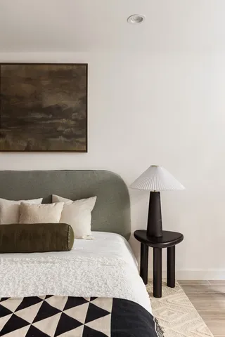 a bedroom with bed and flat screen tv