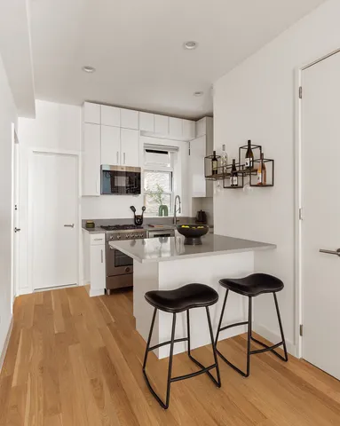 a lamp on a table and a chair